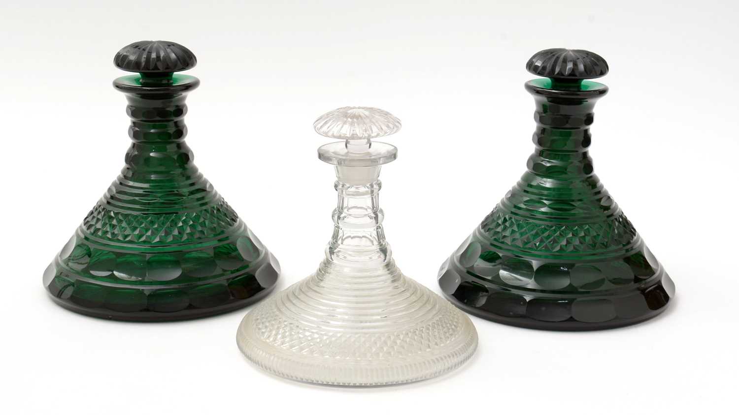 Lot 758 - A pair of 19th Century green conical decanters, and another.