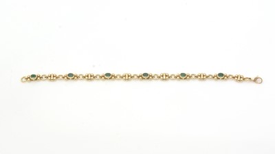 Lot 452 - An emerald and 18ct yellow gold bracelet