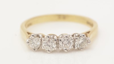 Lot 468 - A four stone diamond ring