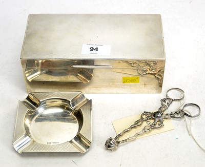 Lot 111 - Silver cigarette box and ashtray and sugar tongs