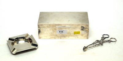 Lot 94 - Silver cigarette box and ashtray and sugar tongs