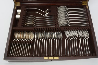 Lot 579 - A composite suite of silver and other cutlery, in mahogany canteen
