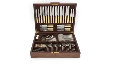 Lot 579 - A composite suite of silver and other cutlery, in mahogany canteen