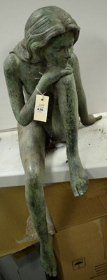 Lot 439 - A cast metal garden ornament, modelled as a figure of a seated lady.