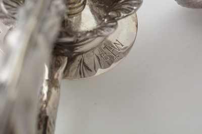 Lot 570 - A George III silver three-branch candelabrum, by Benjamin Smith II