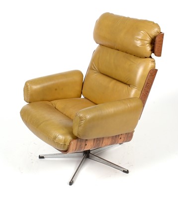 Lot 396 - Guy Rogers of Liverpool: a rare 1960's rosewood ply swivel armchair.