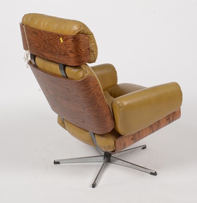 Lot 396 - Guy Rogers of Liverpool: a rare 1960's rosewood ply swivel armchair.