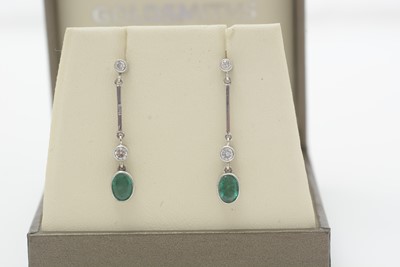 Lot 469 - A pair of emerald and diamond earrings