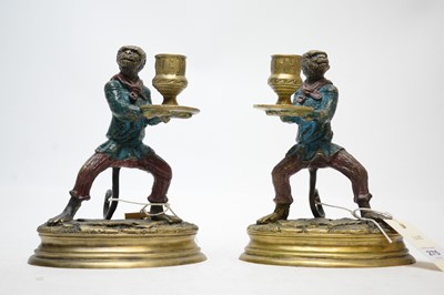 Lot 275 - A pair of bronze chamber candlesticks.