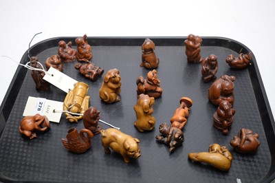 Lot 278 - A collection of Japanese carved wooden netsuke and okimono.