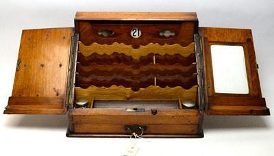 Lot 403 - An early 20th Century oak desk cabinet