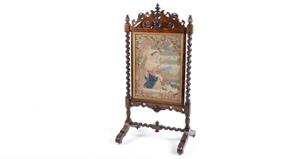 Lot 1255 - A Victorian carved rosewood firescreen.