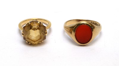 Lot 159 - A signet ring and a citrine ring