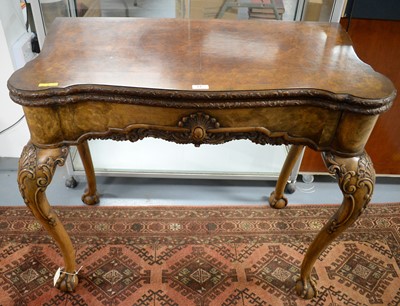 Lot 77 - A Georgian-style burr walnut serpentine fronted card table.