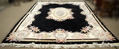 Lot 90 - A Chinese wool bordered carpet.