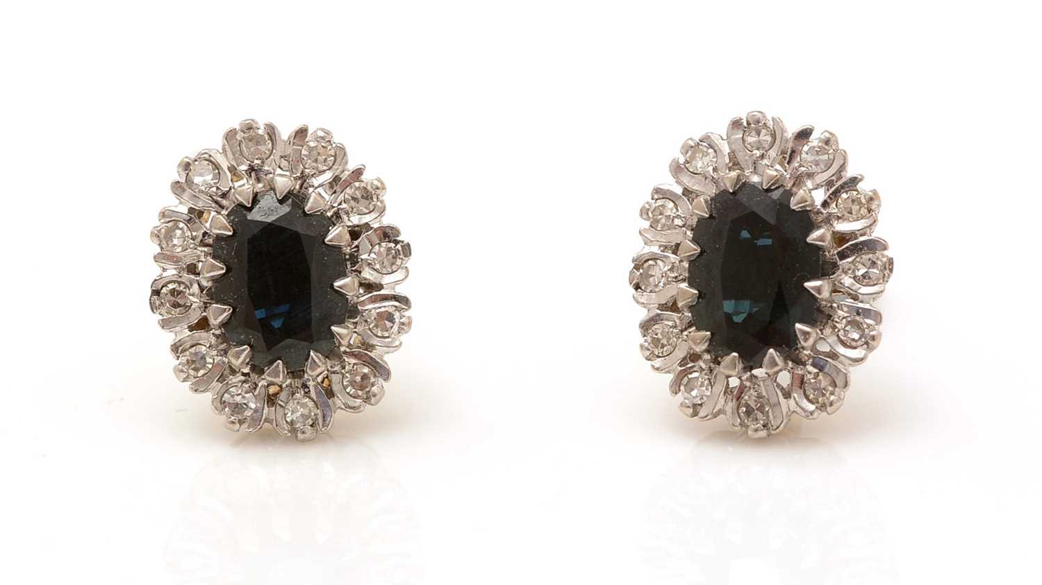 Lot 348 - A pair of sapphire and diamond cluster earrings