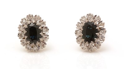 Lot 348 - A pair of sapphire and diamond cluster earrings