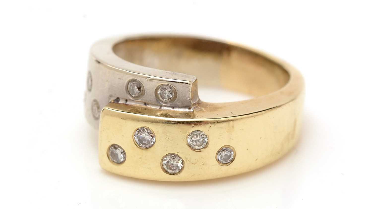 Lot 351 - A 14ct yellow and white gold and diamond dress ring