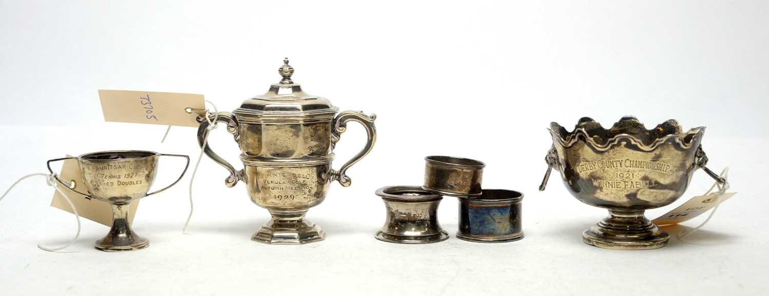 Lot 114 - Silver trophies and napkin rings.