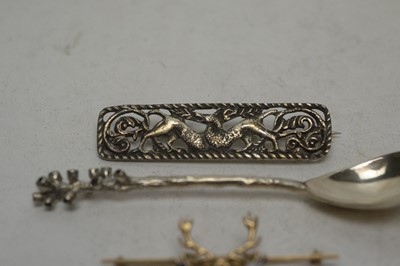 Lot 125 - Silver spoon, brooch, gold sweetheart brooch and a tie pin