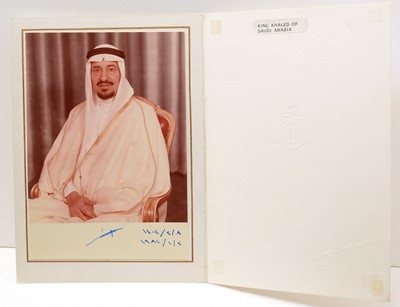 Lot 713 - King Khalid, Saudi Arabia (1913-1982): a signed colour formal photograph of Khalid seated