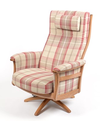 Lot 347 - Ercol: an elm electric reclining and swivel armchair.