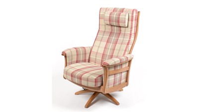 Lot 347 - Ercol: an elm electric reclining and swivel armchair.