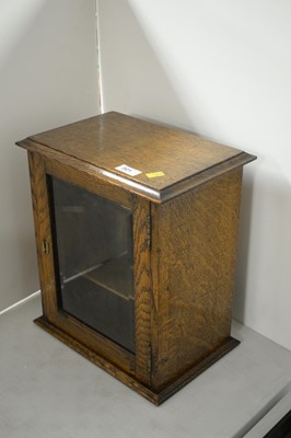 Lot 321 - An oak smokers cabinet.