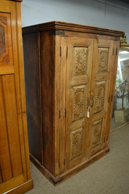 Lot 67 - A carved cupboard in the 19th Century Anglo-Indian style