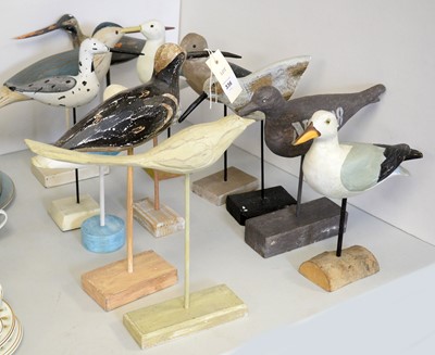 Lot 336 - A collection of carved wood garden bird sculptures.