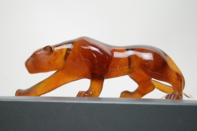Lot 380 - A Daum crystal figure of a panther, in amber.