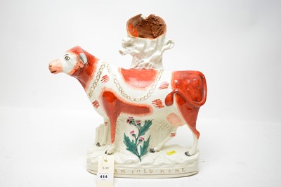 Lot 414 - A Staffordshire cow spill vase.