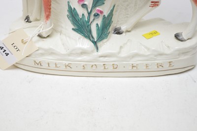 Lot 414 - A Staffordshire cow spill vase.