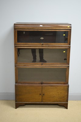 Lot 45 - Wilton: an early 20th Century sectional bookcase.