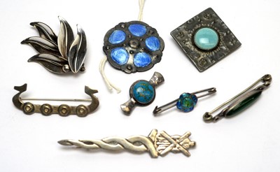 Lot 105 - A selection of Arts and Crafts and other brooches and button.