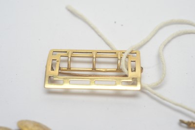Lot 197 - A 14ct yellow gold buckle and gilt metal items