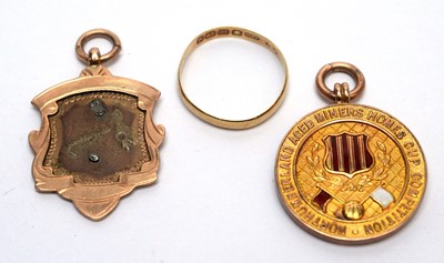 Lot 116 - Two gold fobs and a wedding ring