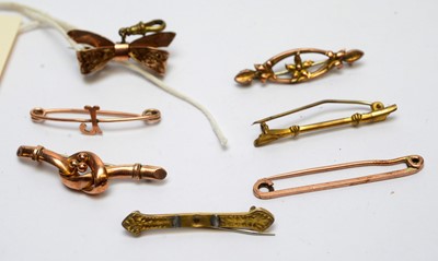 Lot 126 - Three 9ct gold brooches and other gilt metal brooches.