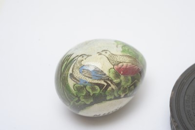 Lot 144 - An early 19th century pressed horn circular snuff box and a darning egg