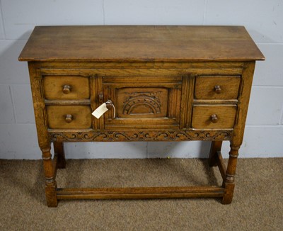 Lot 31 - A mid 20th Century carved oak side cabinet.