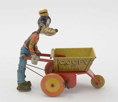 Lot 337 - Marx for Walt Disney Productions: a tin plate lithograph printed clockwork Goofy the Gardener toy