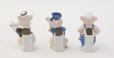 Lot 338 - Genuine Walt Disney copyright ceramic Three Little Pigs toothbrush holders