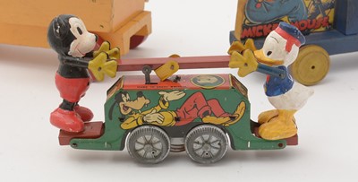 Lot 349 - Two Disney carts and a handcar toy