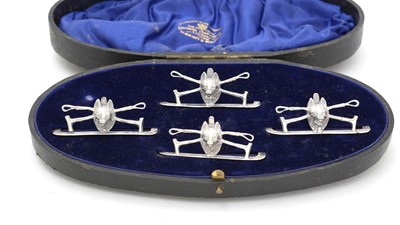 Lot 581 - A set of four Edward VII silver menu stands/place markers