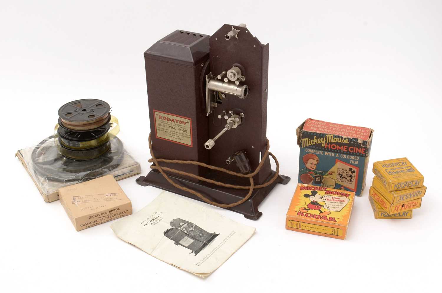 Lot 360 - Kodatoy Universal Model Safety Film Projector; and other Disney reels and films.