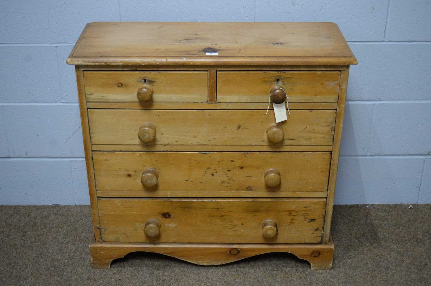 Lot 9 - A 19th Century/20th Century stripped pine chest.