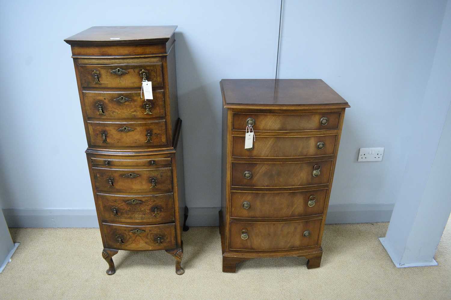 Lot 26 - An miniature bowfront walnut chest on chest; and another bowfront chest