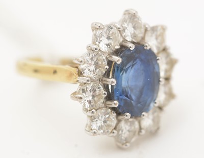 Lot 469 - A sapphire and diamond cluster ring