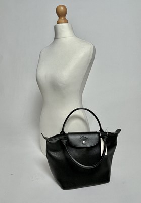 Lot 860 - A Longchamp black leather tote bag