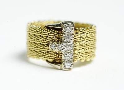 Lot 363 - A 14ct gold and diamond buckle pattern ring